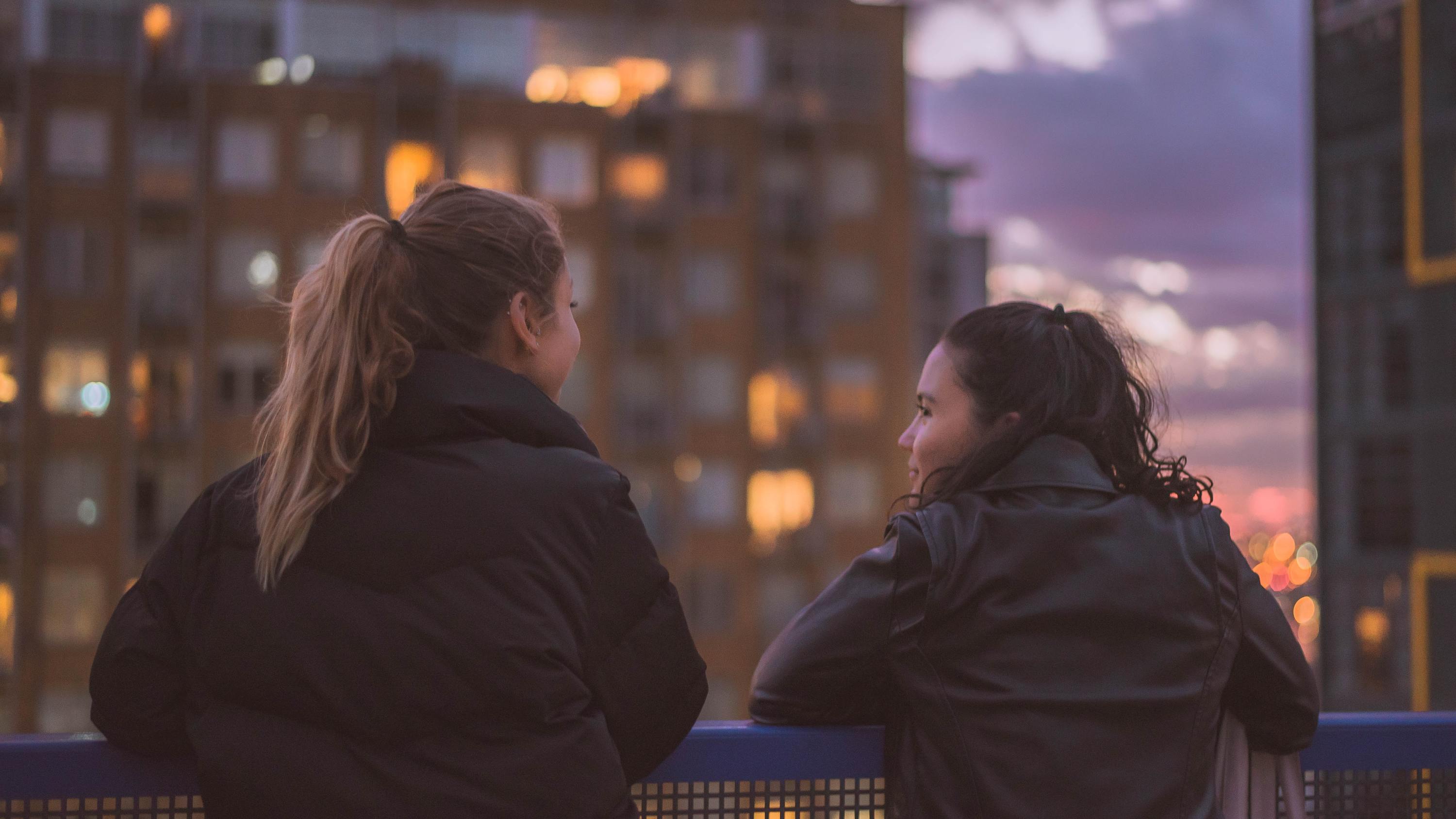 Two people overlooking Sydney