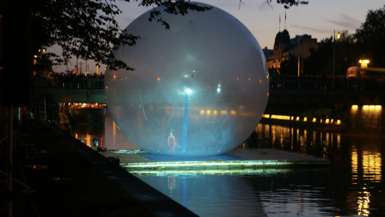 a big plastic bubble on a lake