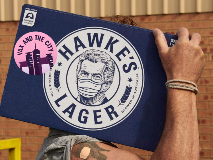 A man carries a case of Hawke's Brewing Company lager