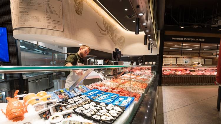 A seafood shop inside a shopping centre