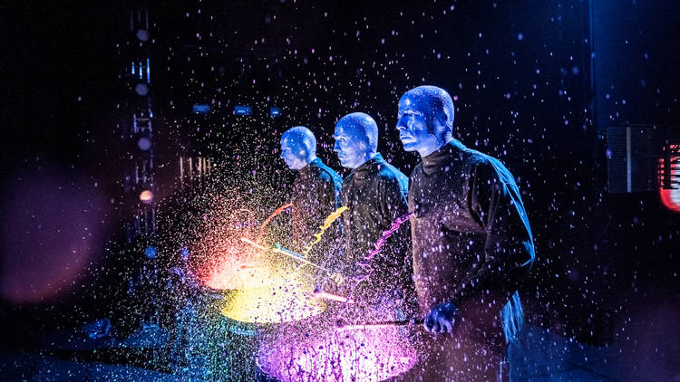 Blue Man Group playing drums