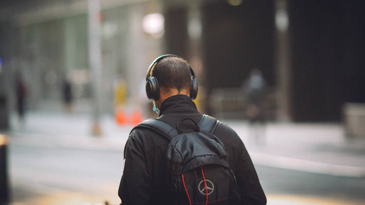 Man listening to podcasts on headphones