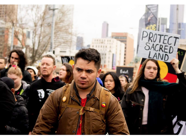 Christopher Jakobi at a climate rally with Indigenous climate organisation Seed