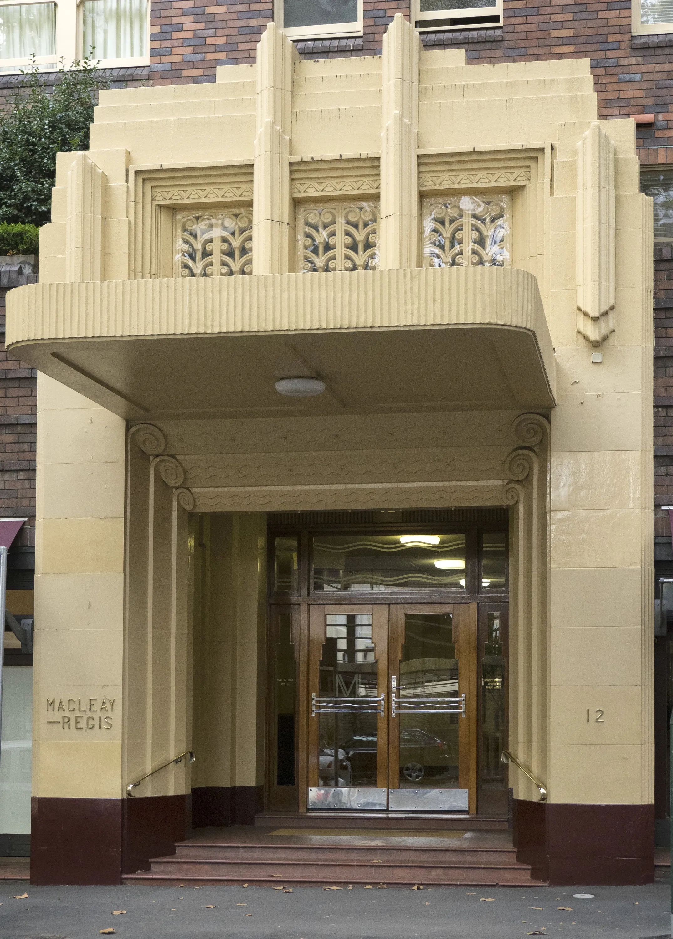 The grand entrance of the Art Deco building the Macleay Regis in Potts Point