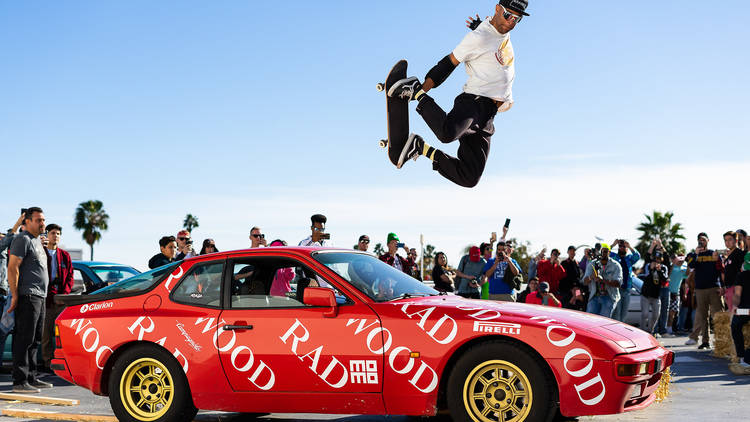 Radwood guy jumping over car on skateboard