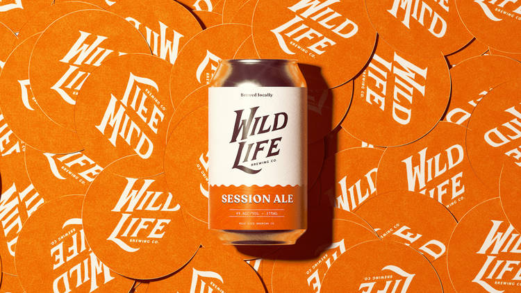 Wild Life Brewing Co can on top of multiple coasters
