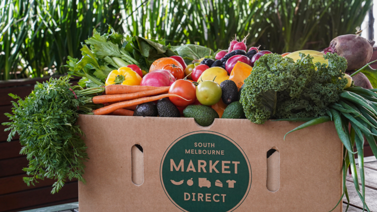 A box of fresh vegetables and fruits from the South Melbourne Market. 