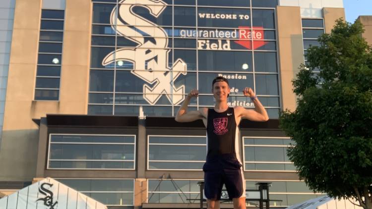 Run Your Sox Off 5K runner standing in front of Guaranteed Rate Field