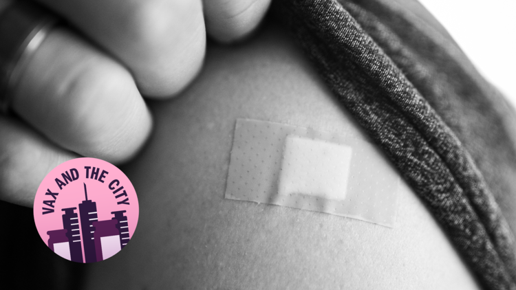 A black and white photo, close up of someone's shoulder with a band-aid