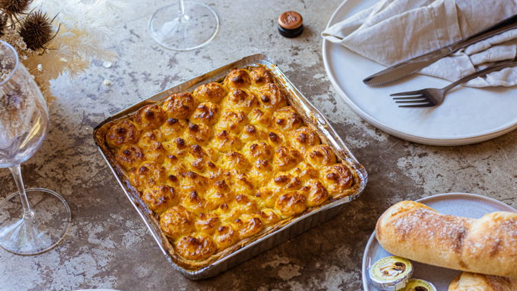 A slate table with a rectangular tray of fish pie