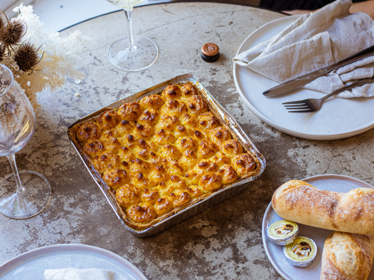 A slate table with a rectangular tray of fish pie