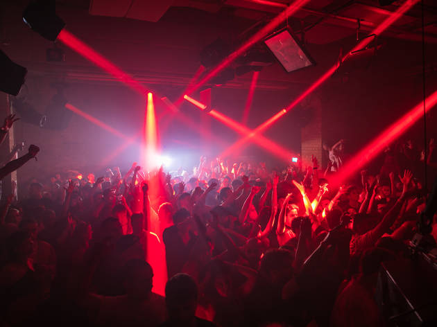 fabric Room 2 Red lights beam across a crowded dancefloor at fabric