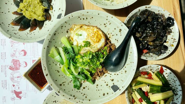 Hand pulled Chengdu zhajiang noodles, cucumbers, wood ear mushrooms, and century egg in spicy sauce at Mian West Adams.