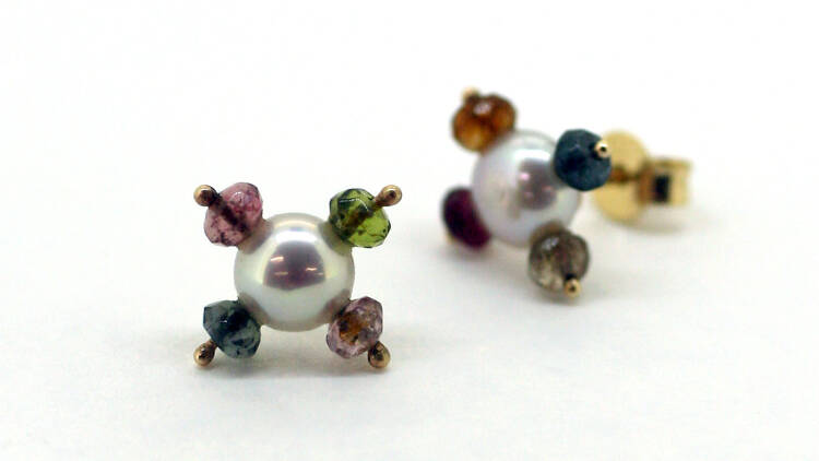 A set of stud earrings with colourful stones.