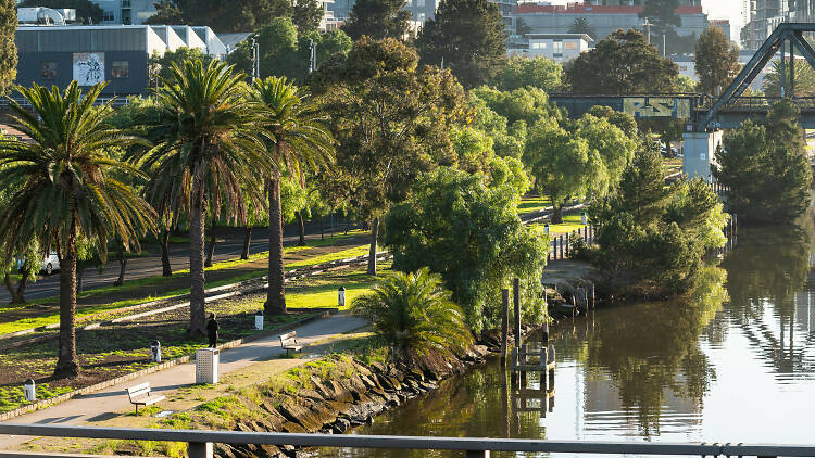 The walking trail by the Maribyrnong river, with skyscrapers in the background