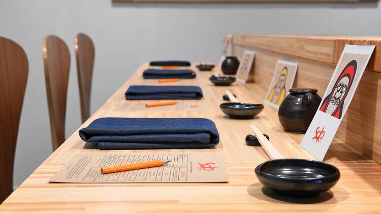 Three place settings at the sushi counter of Soko in Santa Monica.