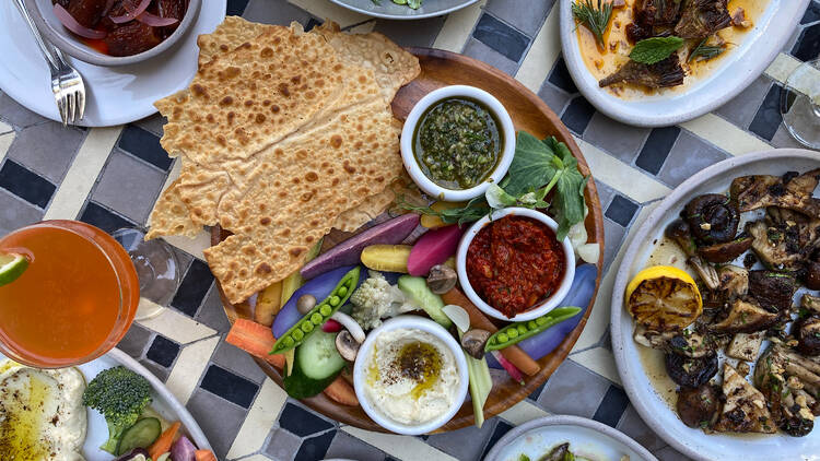 Food spread at Ester's Wine Shop and Bar, including a crudite plate and vegetables.