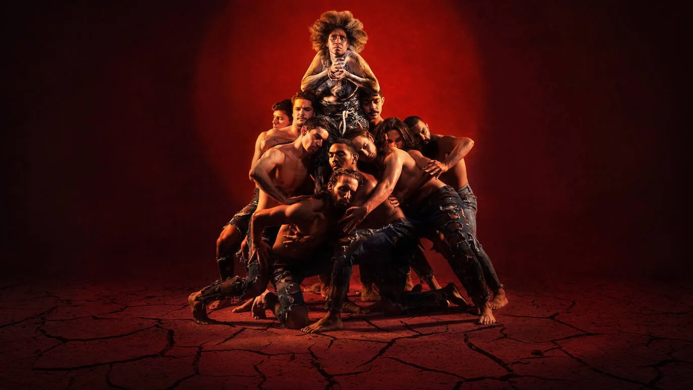 A poerful group of dancers converge to create a human pyramid.