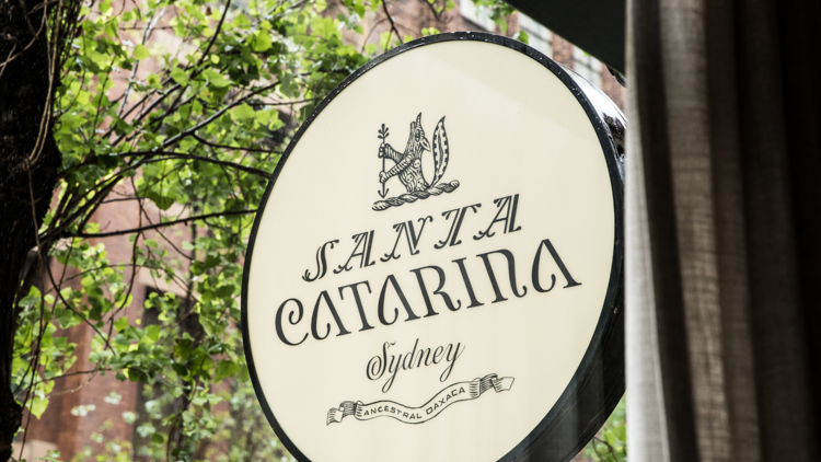 A round white sign reading Santa Catarina Sydney