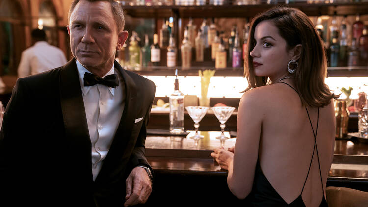 A scene from 'No Time To Die" picturing James Bond in a tux.