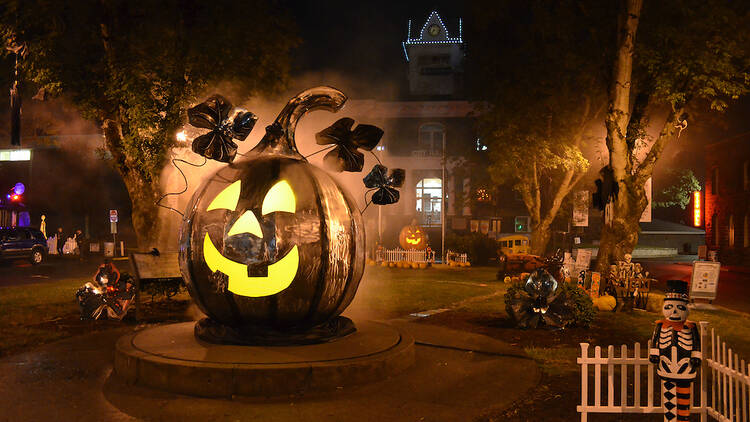 Photo of a large illuminated pumpkin in the town of St. Helens, Oregon during the Spirit of Halloweentown festival