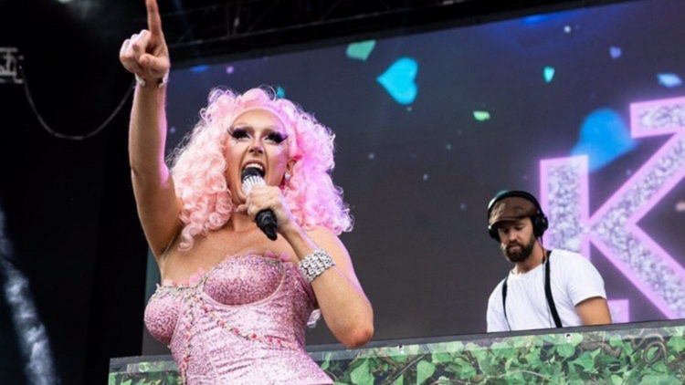 A drag queen performing on stage.