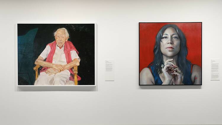Peter Wegner's Archibald Prize-winning portrait of Guy Warren alongside Kathrin Longhurst's Packing Room prize-winning portrait of Kate Ceberano