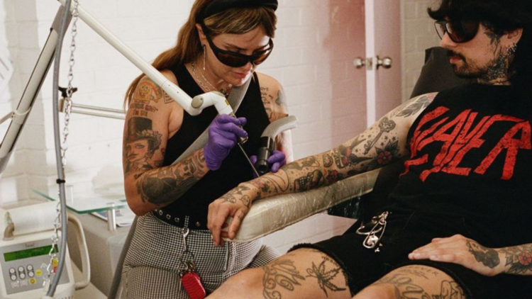 Jade Louise performing laser tattoo removal at her clinic.
