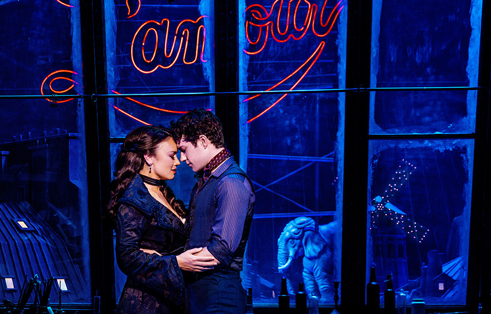 Satine (Alinta Chidzey) and Christian (Des Flanagan) embracing in Moulin Rouge! The Musical