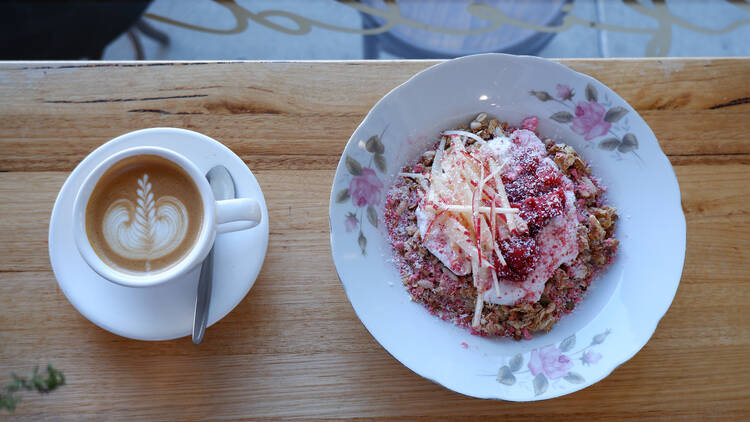 A coffee and bowl of muesli at Ashfield Apothecary