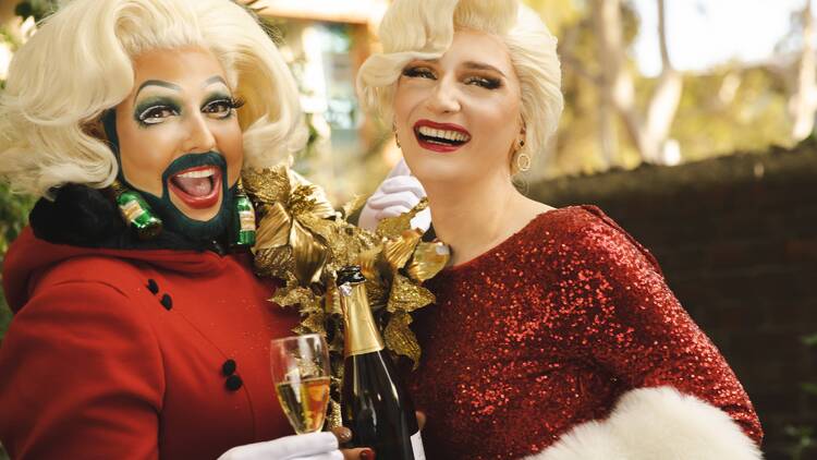Drag queens dressed in Christmas red for Tinsel dinner show