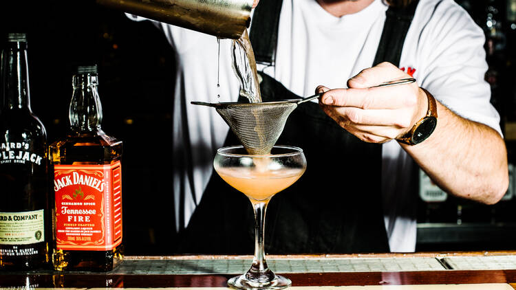 A cocktail being mixed on the bar at Chuck Trailer's