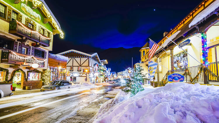 A central street in Leavenworth, WA, that's decorated with Christmas lights.