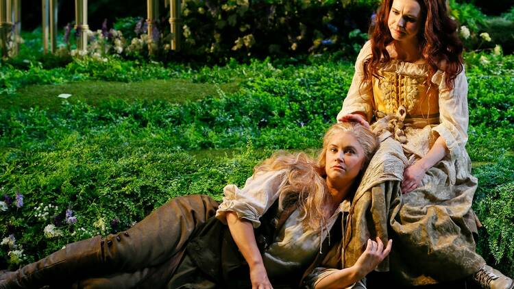 Rosalind (as Ganymede) and Celia (as Aliena) resting and looking ponderous in the Forest of Arden