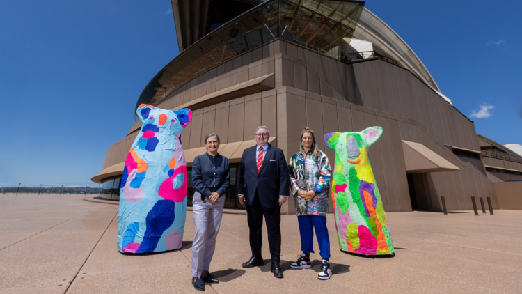 Louise Herron, Minister Don Harwin and Rosie Deacon outside the Sydney Opera House with colourful koala statues