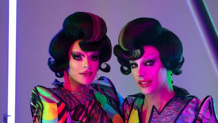 Drag queens Art Simone and Etcetera Etcetera pose in matching costumes