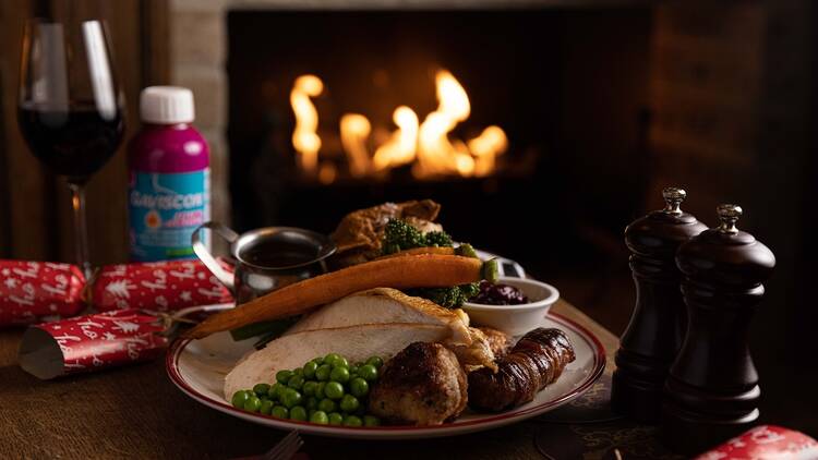 Duke of Clarence turkey roast and Gaviscon in front of a roaring fireplace