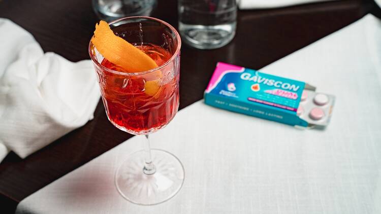 A Negroni and some Gaviscon tablets