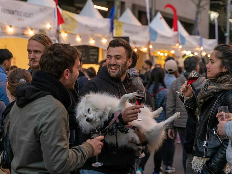 Friends drinking wine in Circular Quay at the Bastille Festival