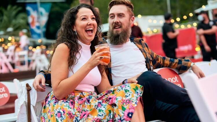 A couple enjoying live open-air music