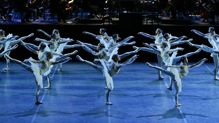 Rows of ballet dancers sticking their legs in the air 