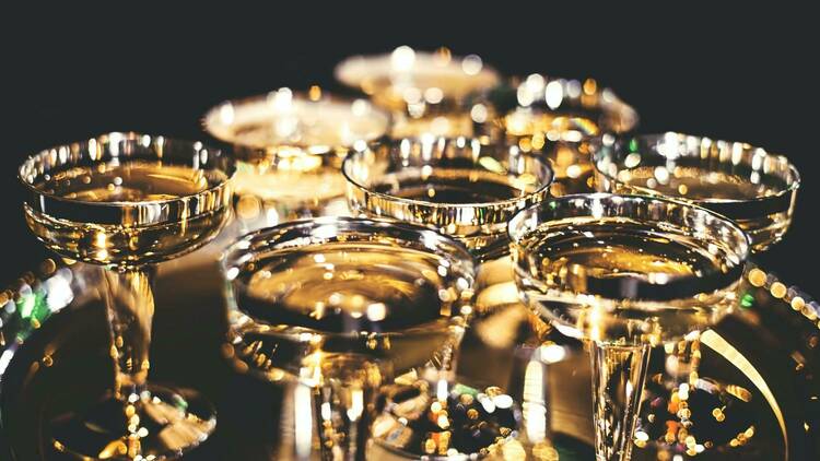 A close-up of a tray of Champagne coupes