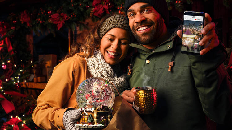 Two people at a Christmas market.