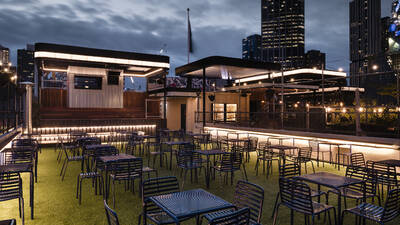 Visit Rooftop Bar on the uppermost level of Curtin House