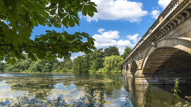 View of Serpentine Lake and Serpentine Bridge in Hyde Park in the summer, London, UK 