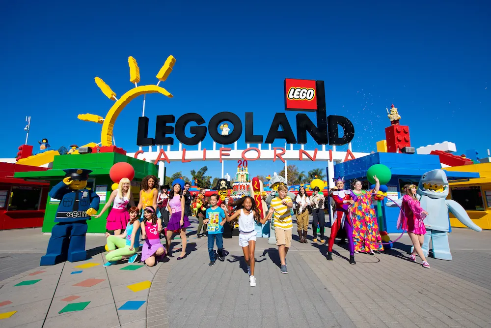 A photo of kids running through the park entrance at LEGOLAND California Resort