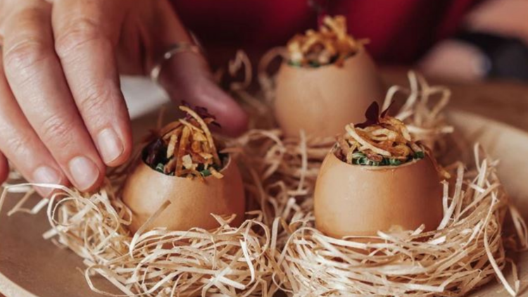 Egg shells in nests with onions and custard within