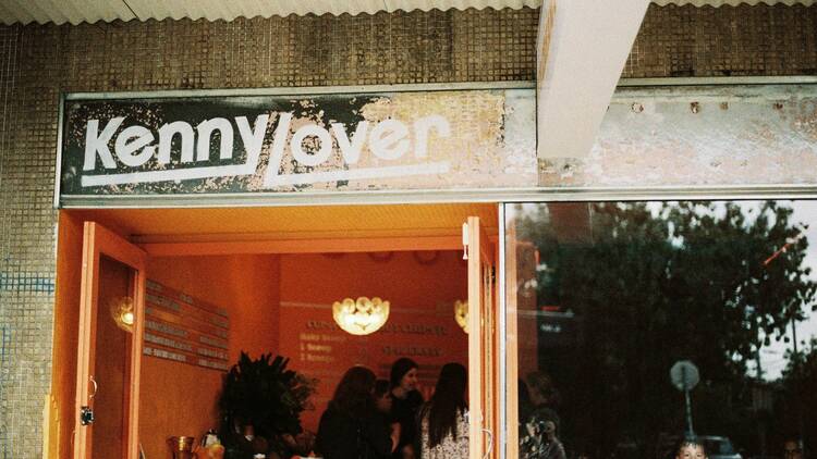 A sign that reads Kenny Lover outside of the ice cream shop.