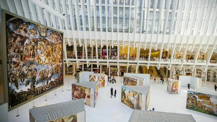 Visitors view the Michelangelo exhibition of the Sistine Chapel.