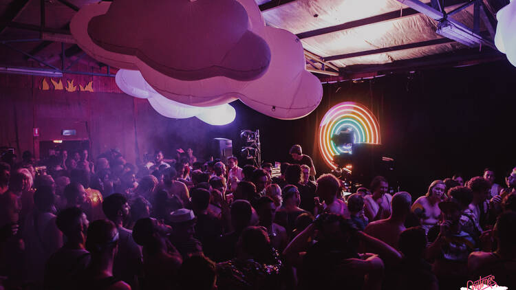 A crowd of people listening to a DJ at Gaytimes.